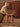 Child playing with a wooden stool in a nursery