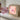 A child's drawing in a Toverlux lamp next to a hand holding the next hand drawn silhouette.