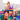 Child playing with colorful magnetic building blocks on a light background