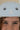 Close-up of a child wearing a light blue helmet with a circular 'Z' logo on the front, showing the child's face and freckles.