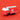Red toy fire truck with ladder on a red background