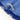 Close-up of a blue fabric with a silver decorative band on a white background