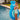Child in a pool with a blue inflatable hippo float