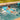 Child on a blue inflatable raft in a pool