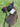 Hobby horse with bridle and a tag on a grassy background