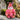 Pink owl plush toy with a unique design on a rock with natural background