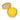 Yellow dumpling squish in a beige steamer container on a white background