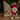 Christmas-themed book with a plush toy elf in front of a decorated tree.