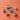Set of wooden stamps with various designs on a coral background