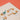 A close-up of a children's paper craft kit sheet showing geometric animal cutouts, including a dog and a cat on a beige card against a textured orange background.