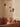 Baby in a crib with a Ferm Living mobile above, featuring stars and planets.