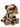 A plush toy of a saber-toothed cat with beige fur, black spots, brown ears and muzzle, and white tusks, photographed on a solid white background.