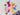 Colorful dinosaur-shaped toys on a textured white surface