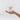 White bear-shaped night light held in a hand against a white background