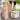 Wooden building blocks stacked into a tower with children cheering in the background, next to a storage box labeled 'KAPLA'.