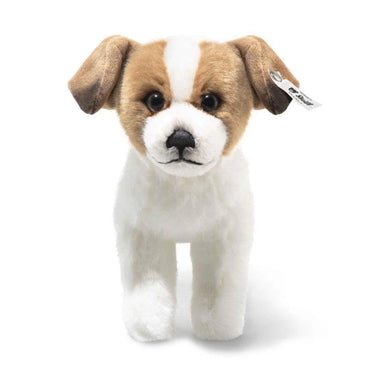 Plush toy dog with brown and white fur on a white background