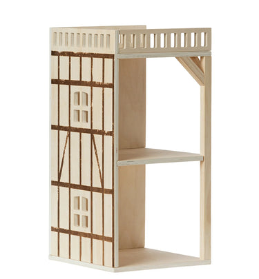 Wooden dollhouse with balcony on a white background