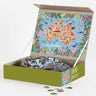 Puzzle box with a colorful map of Australia on the lid, containing a puzzle with pieces spilling out.