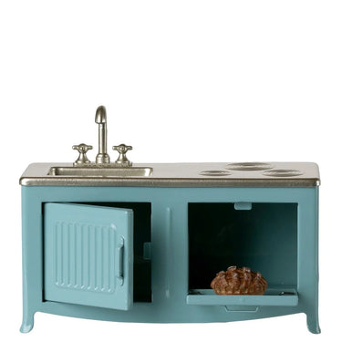 Teal toy kitchen set with sink and stove on a white background