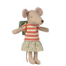 Stuffed mouse toy wearing a striped shirt and floral skirt on a white background