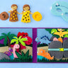 Children's felt activity book with dinosaur figures, a boy and girl figure and a dinosaur mask on a blue background