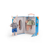 Toy rabbit with checkered shirt and blue pants in a suitcase with clothes on a white background
