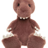 A pink soft plush dinosaur teddy bear with large white teeth and nails on a white background. 