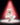 A Steiff collectable teddy bear representing Marilyn Monroe wearing a white dress with a red spotlight background