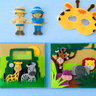 Children's educational toys including a felt book, animal masks, and figures on a blue background