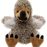 A plush stuffed animal shaped like a small bird or chick, with shaggy gray-brown fur, tan face and feet, white wings, and a black beak and claw tips, photographed on a plain white background.