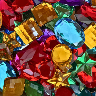 Close up picture of acrylic gems in different sizes and colours. 