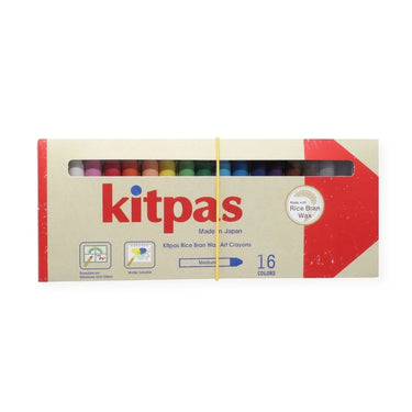Kitpas 16-color rice bran wax crayons in a cardboard box with a clear window showing the colorful crayons inside, secured with a yellow string.