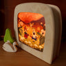 Wooden Toverlux  lamp with fairy tale design on a wooden surface