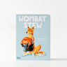 Book titled 'Wombat Stew' with a fox illustration on a light blue background