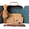 Maileg Reindeer in Suitcase Little Sister, a 16cm patterned suitcase opening on a reindeer's sofa bed and rug