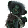Plush toy bear in green with a neck tie on a white background