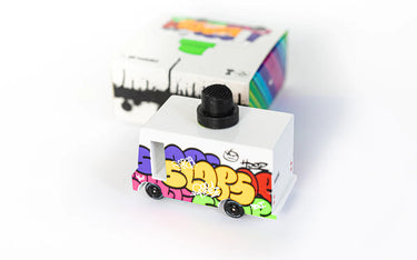 Small toy truck with colorful graffiti-style text on a white background
