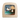 Wooden Toverelux lamp with a painted scene of a stork delivering a baby, flying over water on a white background