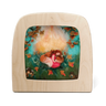 A wooden Toverlux lamp with rounded corners, featuring a silicon print of a felted wool artwork of a sleeping fox and girl in a forest scene, set against a plain white background.