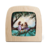 Wooden Toverlux lamp with a painted scene of three siblings sitting on a tree branch on a white background
