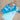Child on a blue inflatable toy on a sandy beach