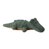 A plush alligator dog toy in dark green with a brown underside, shown on a plain white background.