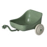 Green metal trailer with a white wheel on a white background
