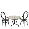 Round table with floral design and two matching chairs on a white background