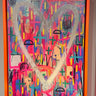 Abstract artwork with colorful patterns and shapes in a frame.