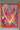 Abstract artwork with colorful patterns and shapes in a frame.