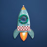A rocket shaped compound kaleidoscope on a blue background