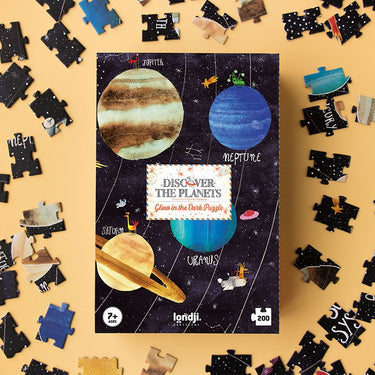 A 200-piece glow-in-the-dark solar system puzzle on a yellow background
