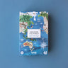 A decorative box with a 200-piece world map puzzle on a blue background