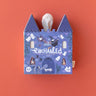 A puzzle box called "enchanted" that is in a spooky castle box with a ghost popping out the top. 